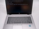 a laptop that is sitting on a white table