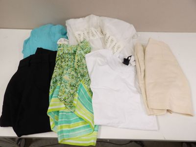 a lot of clothes that are on a table