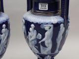 pair of blue and white vases sitting on top of a table