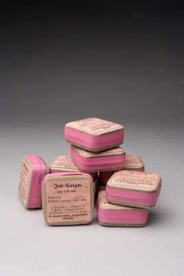 six pink soap bars stacked on top of each other on a table