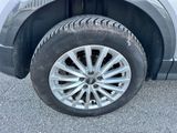 a close up of a car ' s tire on the pavement