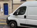 a white van parked on the side of the street