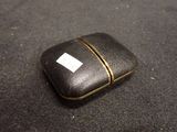 a small black case with a white label on it