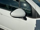 a white car with a mirror on the side of it