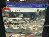 two books on the shelf of a car showroom