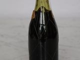 a bottle of wine that is sitting on a table