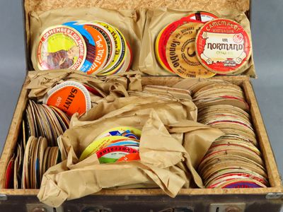 a suitcase filled with different types of coasters and coasters