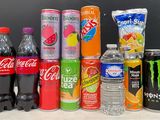 many sodas and soft drinks that are on the table
