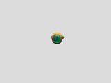 a close up of a ring with a green stone on it