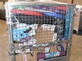 a metal cart with many items in it in a warehouse
