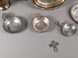 a lot of silver objects that are on the table