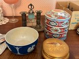 a wooden table topped with a bowl and other items