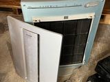 a blue and white stove and a black stove top oven