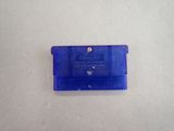 a small blue gameboy game case on a table
