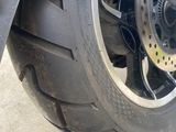 a close up of a motorcycle tire on the ground