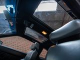 a view of the inside of a car from the driver ' s seat