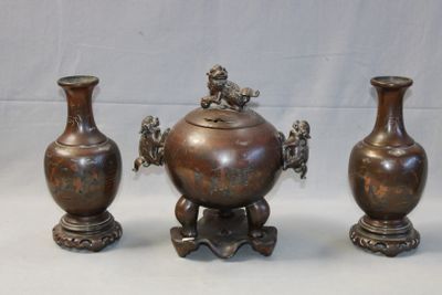 three vases sitting next to each other on a table