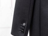 a close up of a coat with buttons on a mannequin mannequin mannequin mannequin mannequin mannequin mannequin mann