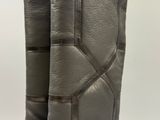 the back view of a pair of boots with a zipper on the side