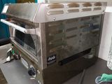 a toaster oven sitting on a counter in a kitchen