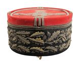 a red and black box with gold designs on it