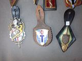 a lot of medals that are hanging on the wall