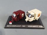 two toy trucks that are sitting on a table