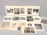 an assortment of old photographs of men and women are displayed on a table