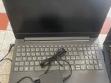 two laptop computers are sitting on a tiled floor next to each other