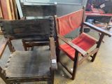 two wooden chairs with red seats in a room