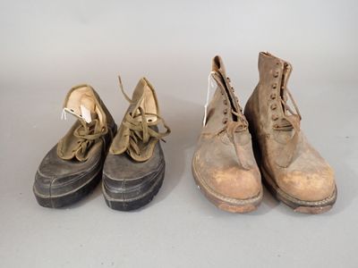 three pairs of shoes are lined up on a white surface