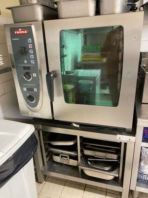 a large commercial oven sitting in a kitchen next to a sink