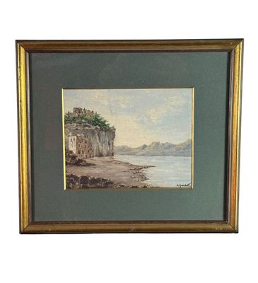 peinture à l'huile encadrée représentant une scène de plage avec une falaise en arrière-plan