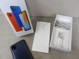 an image of a box with a phone in it next to a box with a charger