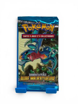 a close up of a blue card case with a dragon on it