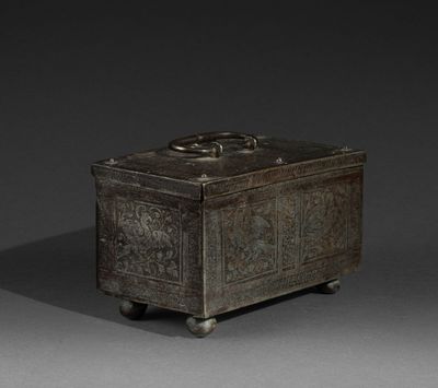 an old metal box sitting on top of a gray surface