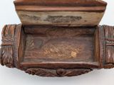a wooden box with a planter on top of it