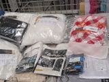 many bags of clothing on a table in a store