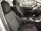 the interior of a car with black seats and a steering wheel