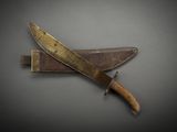a knife that is laying on top of a piece of wood