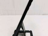 a tablet that is sitting on a stand on a table