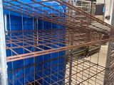 a cage that has some blue containers inside of it