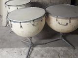 three drums that are sitting next to each other on the floor