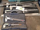 a tool box with a caliper and other tools in it
