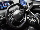 the interior of a car with a steering wheel and dashboard controls