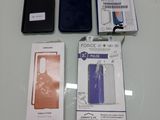 several cell phones are sitting on a table next to each other
