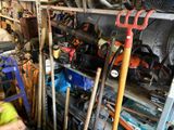 many tools that are sitting on the shelves in the garage