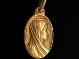 a close up of a gold medal on a black background