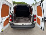 a white van with its doors open in a parking lot
