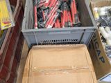 many different types of tools in boxes on the floor